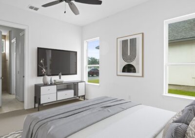 A spacious bedroom with a walk-in closet and an en-suite bathroom.