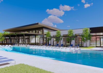A resort-style swimming pool with a sundeck, lounge chairs, and palm trees.