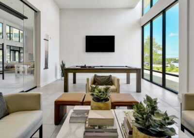 A modern community clubhouse with a resident lounge, a coffee bar, and comfortable seating areas.