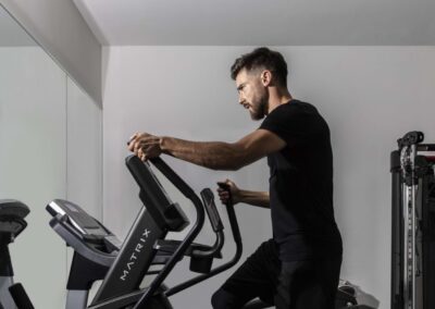 A professional fitness center with cardio equipment, free weights, and strength-training machines.