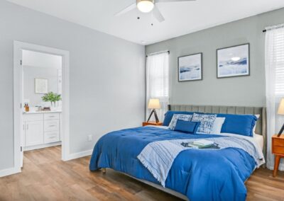 Master suite with plush carpeting, large walk-in closet, and expansive window views