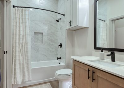 Upscale bedroom featuring plush carpeting and large walk-in closets.