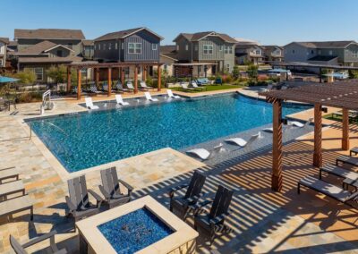 Resort-style swimming pool with private cabanas and sundeck.