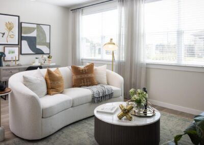 Sun-drenched living room with wood-style flooring at SA1335 in New Braunfels - Apartment Buddy
