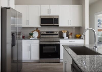Gourmet island kitchen with Samsung appliances at SA1335 in New Braunfels - Apartment Buddy