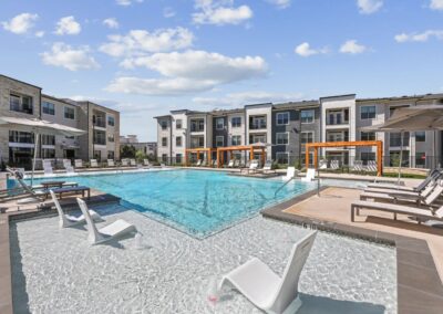 Luxury Resort-style Pool with tanning ledge and social deck at SA1353 in New Braunfels - Apartment Buddy.